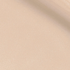 Swatch of a glowy, luminous primer in a light grey-beige shade.