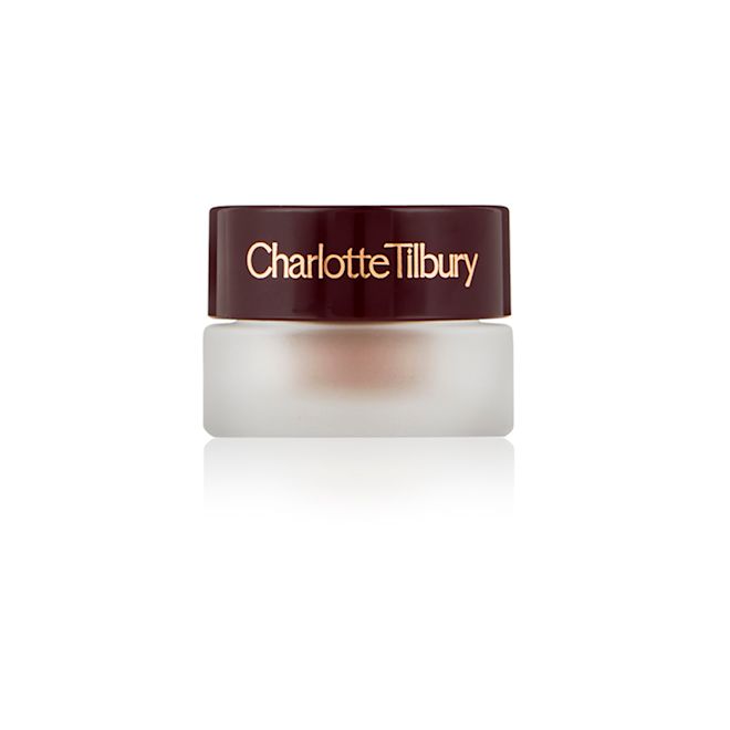 Eyes to Mesmerise in Nude Cashmere closed A closed frosted glass pot with a cream eyeshadow in a nude cashmere shade with a matte finish with a dark brown lid with Charlotte Tilbury written on the lid in gold.