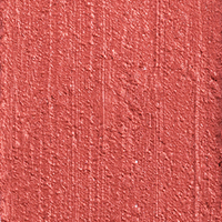 Swatchh of a lip and cheek colour stick in a glowy coral shade.