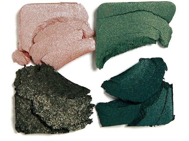 Swatches of four matte and shimmery eyeshadows in champagne, light green, teal, and dark green sahdes.