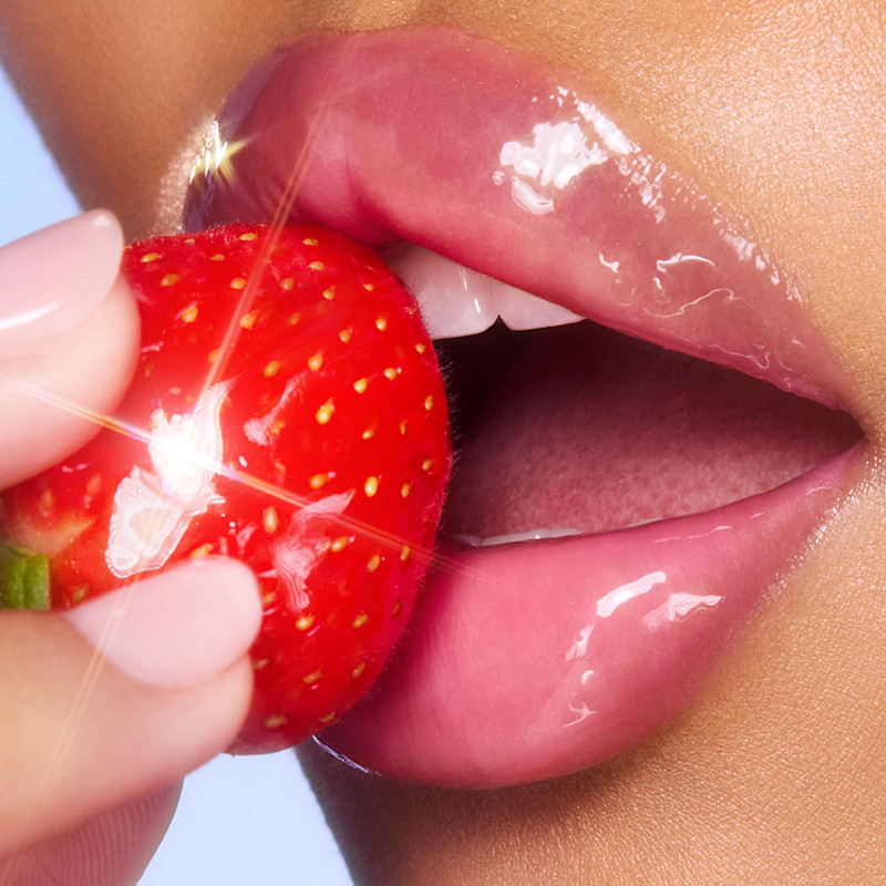 pH colour-changing lip oil on tan skin