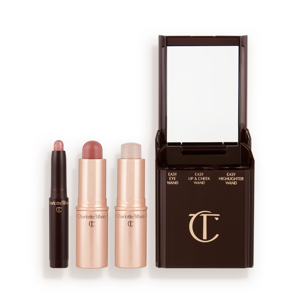 An open shadow stick in a shimmery pink shade, a lip and cheek blush stick in a soft pink shade, and highlighter stick in an opal shade.