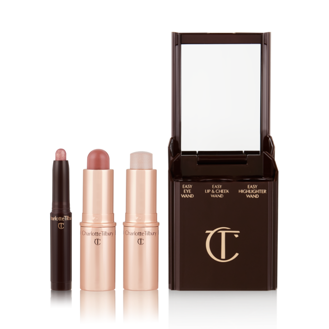 An open shadow stick in a shimmery pink shade, a lip and cheek blush stick in a soft pink shade, and highlighter stick in an opal shade.