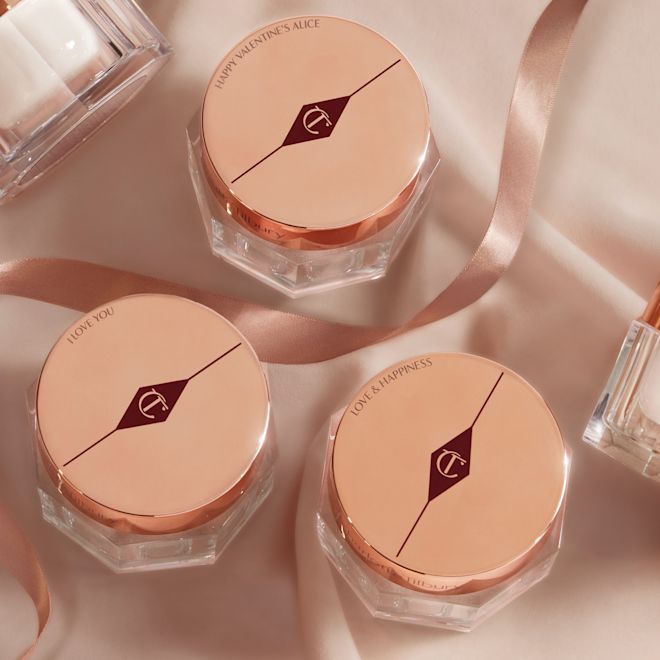 Charlottes Magic Cream collection with engraved lids Collection of thick, pearly-white creams in glass jars with gold-coloured engraved lids with the CT logo printed on top.