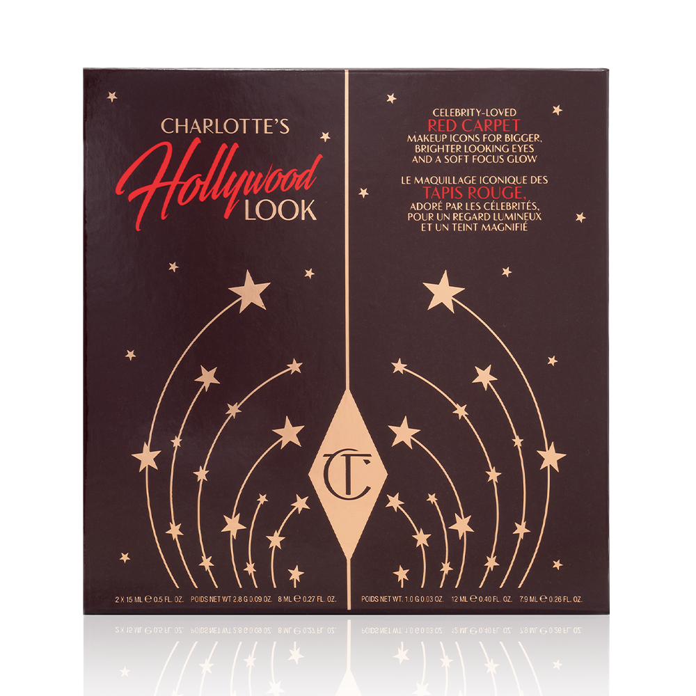 A dark-brown-coloured makeup gift box with stars printed on it in golden colour, along with the CT logo and the name of the kit, Charlotte's Hollywood Look' displayed on the top of the box.