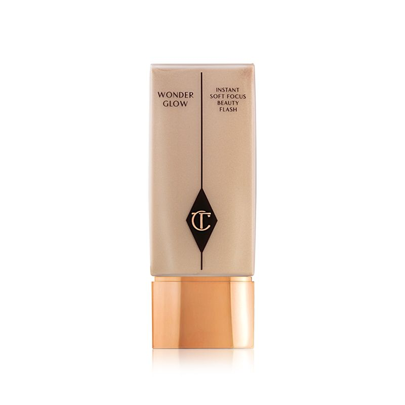 A medium-tone face primer with the CT logo printed on it with a golden-coloured, metallic lid. 