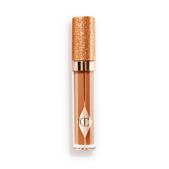 Jewel Lips in Blushed Gold A closed, shimmery, gold-coloured lip gloss with rose gold sparkles and a glittery lid.