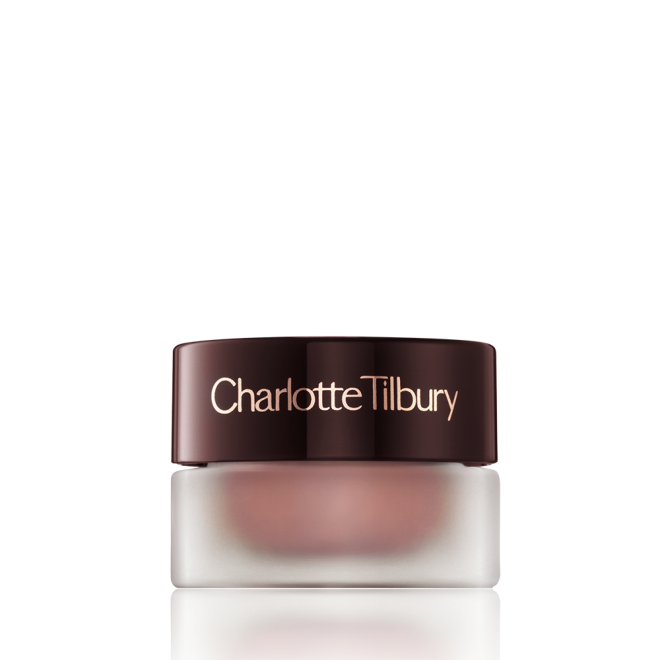 Cream eyeshadow in a glass pot in a nude pink shade with fine shimmer with a dark brown-coloured lid.