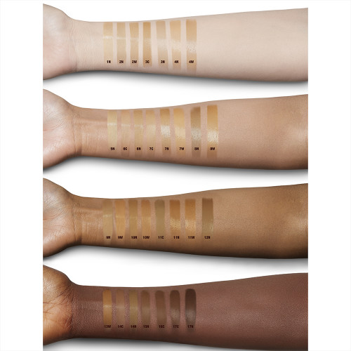 Fair, light, tan, and deep-tone arms with swatches of liquid foundations in thirty shades of fair, light, medium, medium-light, medium-dark, and deep-tone complexions.