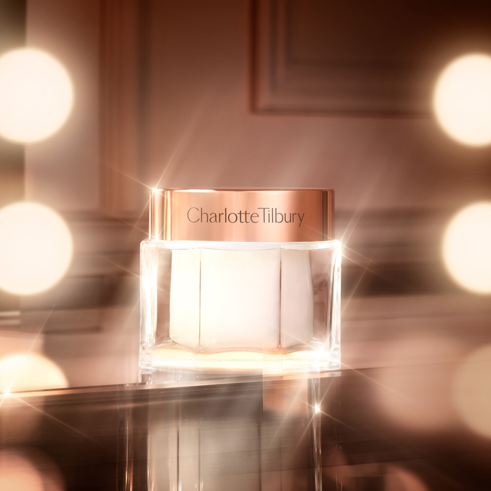 Charlotte's Magic Cream moisturiser jar backstage with mirror lights