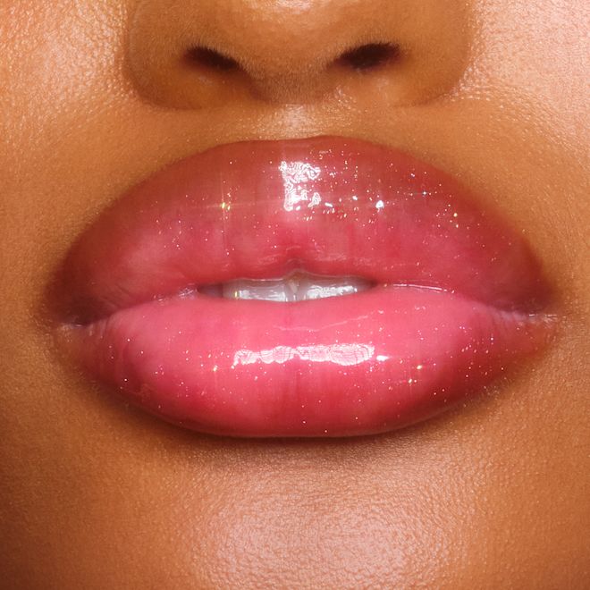 Jewel Lips Pinkgasm Sunset on deep skin tone model close up Jewel Lips Pinkgasm Sunset on deep skin tone model close up