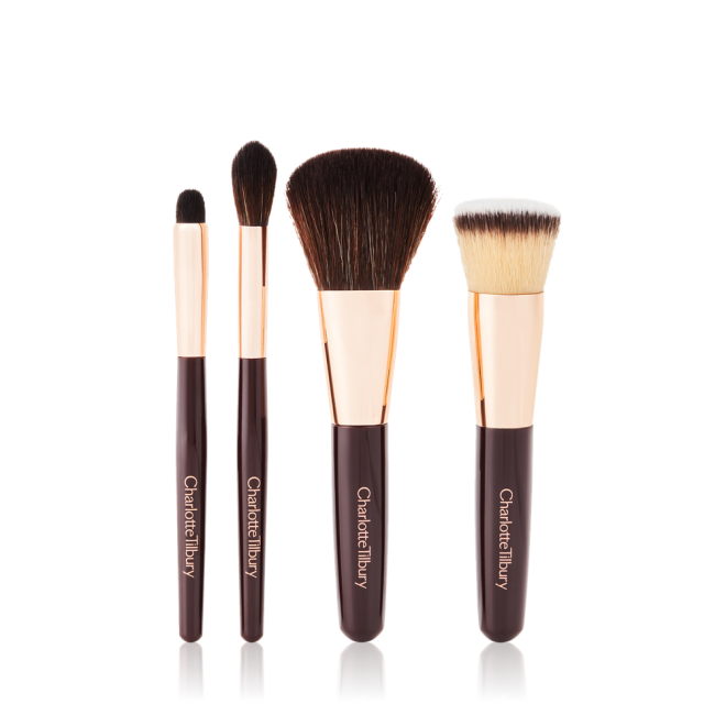 A foundation brush, powder brush, an eyeshadow brush, and a bronzing brush. 