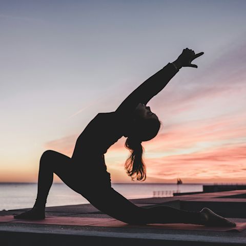 Mental Health Awareness Week model doing yoga to benefit mental health