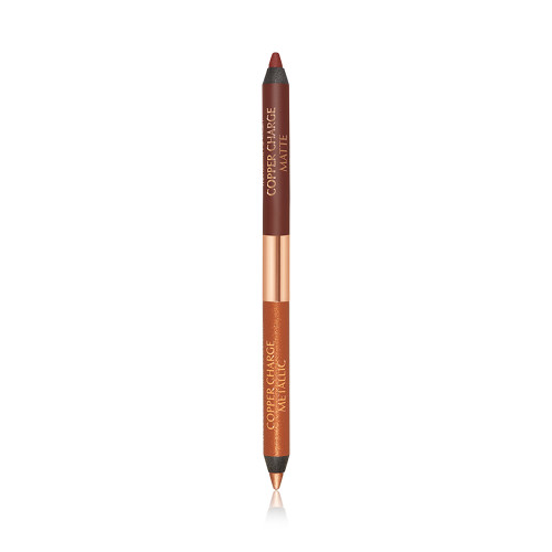 An open, double-ended eyeliner pen in warm rust and copper colours. 