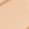 Close-up swatch of a skin-like, glowy foundation in a light beige shade.