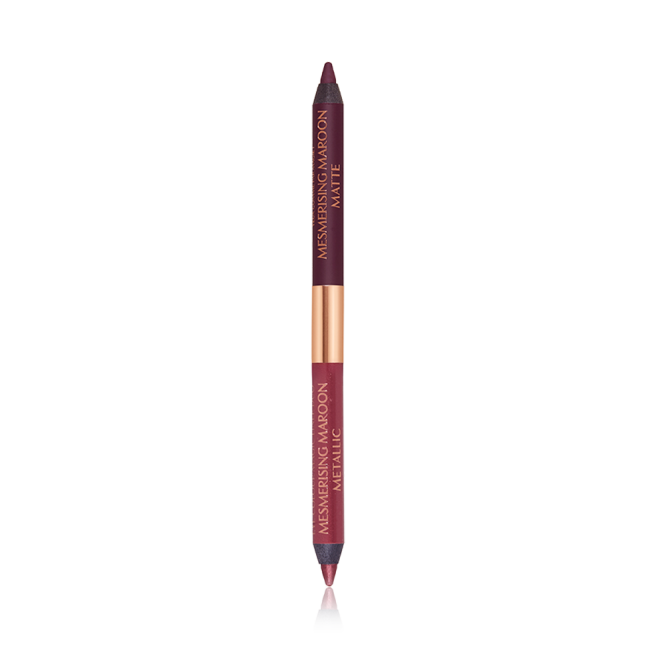 A double-ended eyeliner with lids removed with one side a bright maroon and the other a rich violet.