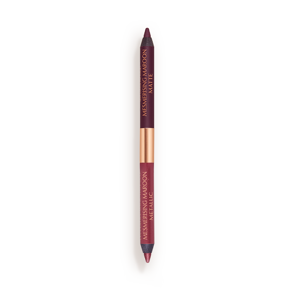 A double-ended eyeliner with lids removed with one side a bright maroon and the other a rich violet.
