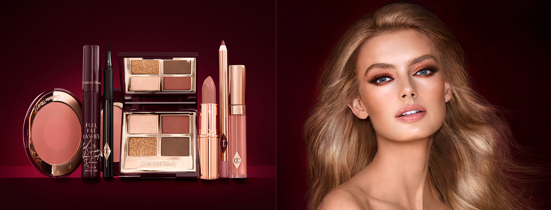 A fair-tone model with blue eyes wearing smokey brown and gold eye makeup with warm pink blush and glossy nude-pink lips next to a makeup kit that includes an open, mirrored-lid eyeshadow palette in matte and shimmery brown and gold shades, an open black eyeliner pen, a mascara in a dark-crimson colour scheme, a berry-rose lipstick with a matching lip liner pencil, nude pink lip gloss, and an open two-tone blush in warm pink. 
