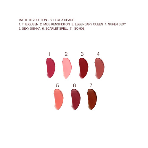 Swatches of seven lipsticks with a matte finish in shades of red, pink, peach, and brown.