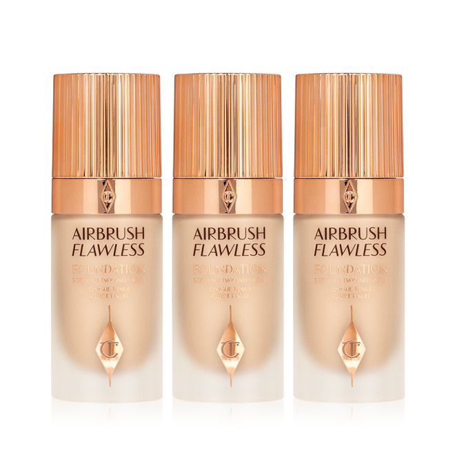 Three foundations in fair shades in frosted glass bottles with gold-coloured lids. 
