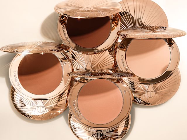Eine Reihe geschlossener Bronzerdosen mit drei offenen Bronzerdosen in hellen, mittleren und mitteldunklen Farbtönen.