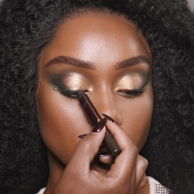 Step 7 of Charlotte's 70s makeup tutorial is to glide cream eyeshadow along the lash line