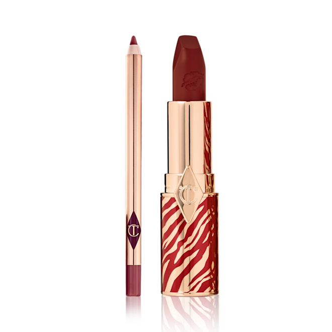 Lunar New Year Lip Kit in K-Romance open An open lip liner pencil in a maroon shade with an open lipstick in a muted berry-rose shade, in a gold-coloured tube with red tiger stripes all over the bottom half of the tube in celebration of the Lunar New Year.