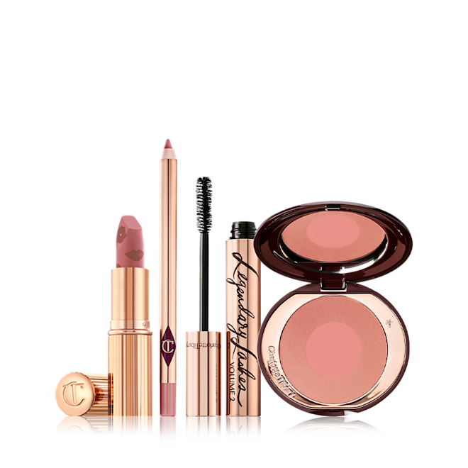 Wedding Belles Bundle open An open matte lipstick in nude pink with a nude-pink lip liner pencil, black mascara in gold packaging, and two-tone blush in a warm pink shade.