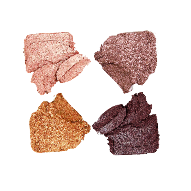 Swatches of a quad eyeshadow palette with shimmery eyeshadows in shades of brown, pink, grey, and gold.