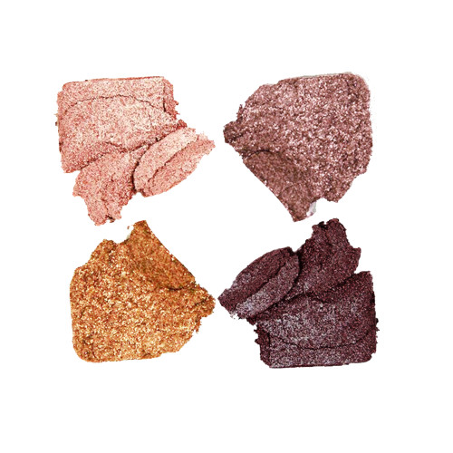 Swatches of a quad eyeshadow palette with shimmery eyeshadows in shades of brown, pink, grey, and gold.