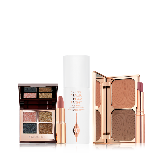 Open, quad eyeshadow palette with a mirrored-lid with shimmery shades of teal, rose gold, bronze, and dark brown, nude pink matte lipstick, pearly-white face cream in a white bottle, duo contour palette, and nude pink sheer lipstick in a gold-coloured tube.