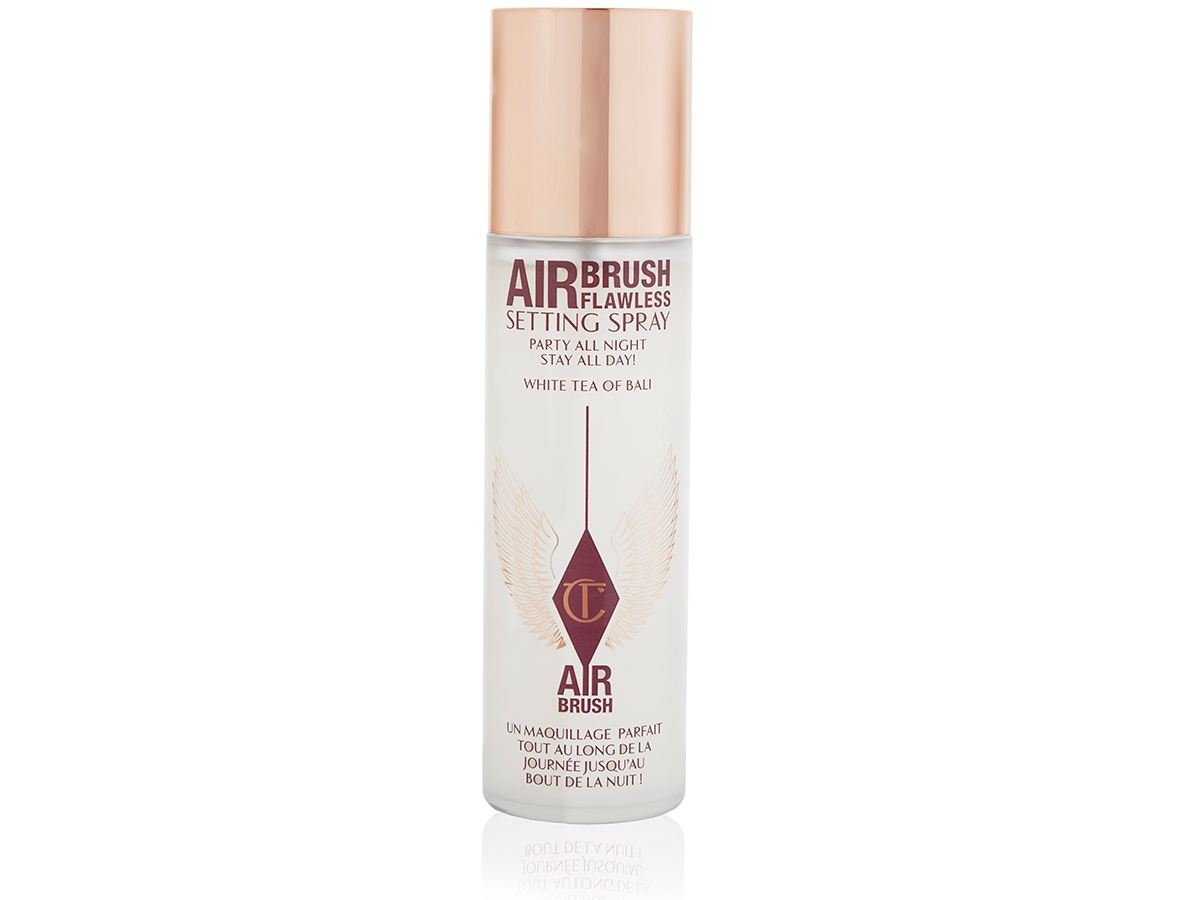 Scented setting spray in a clear bottle with a light gold-coloured cap.