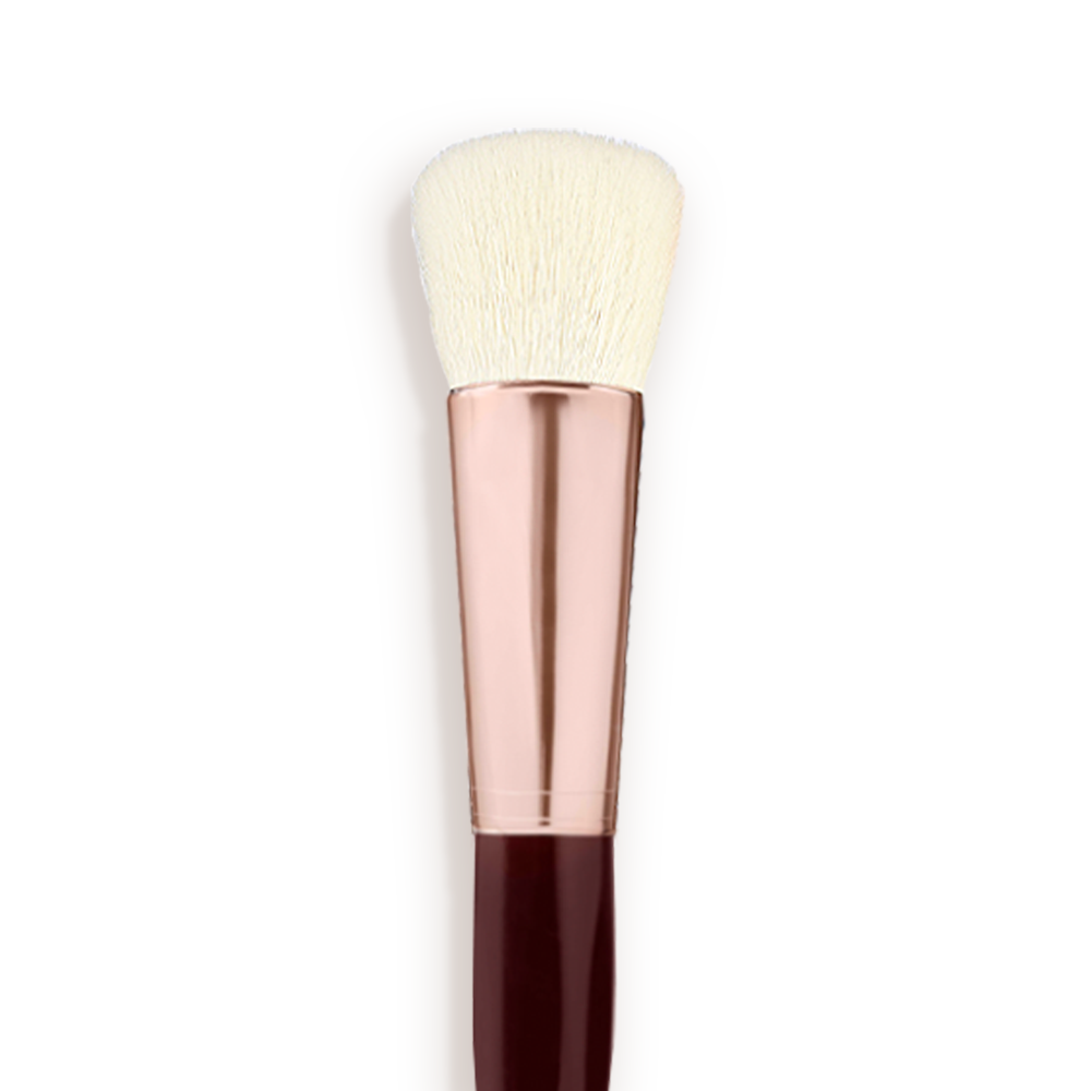 A face blending brush with cream-coloured bristles with a rose-gold and dark crimson handle. 