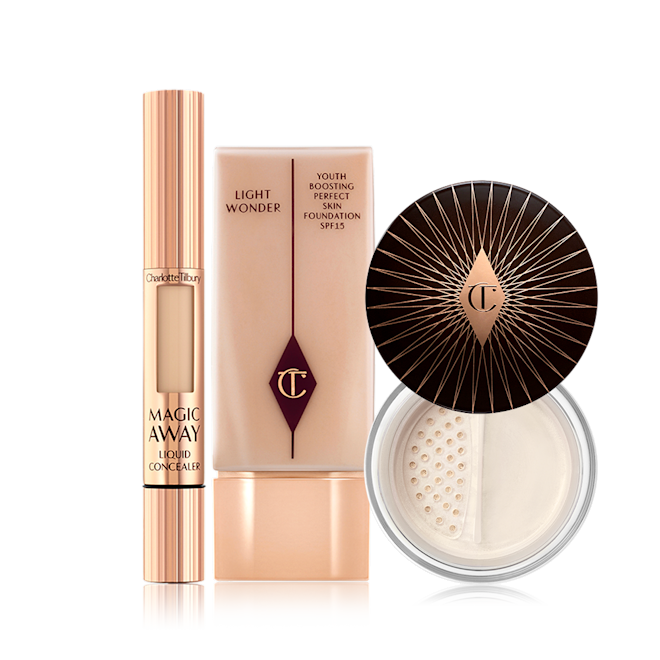 Fresh Glowing Complexion Kit displayed Cream concealer in a rose gold tube, primer in a clear bottle with a rose gold-coloured lid, and finishing powder in a glass jar with a dark brown-coloured lid.