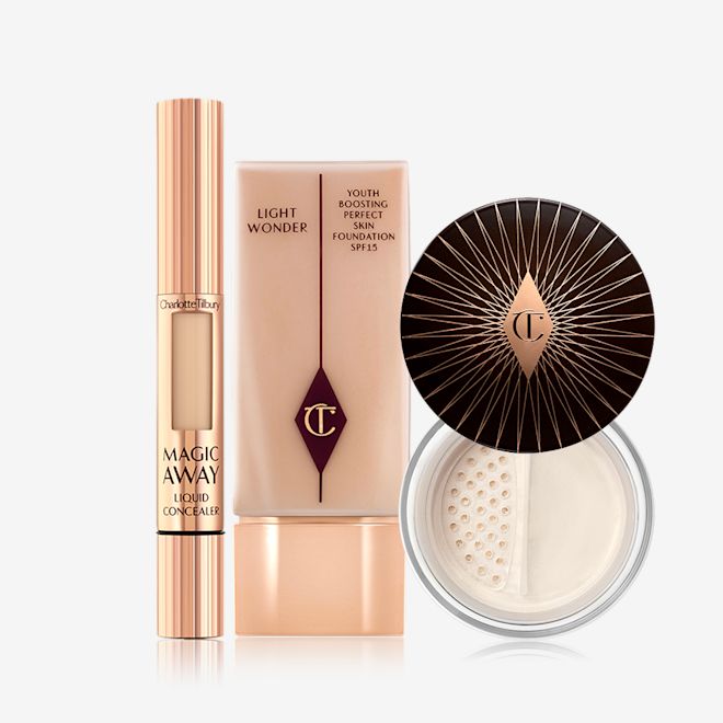 Fresh Glowing Complexion Kit displayed Cream concealer in a rose gold tube, primer in a clear bottle with a rose gold-coloured lid, and finishing powder in a glass jar with a dark brown-coloured lid.
