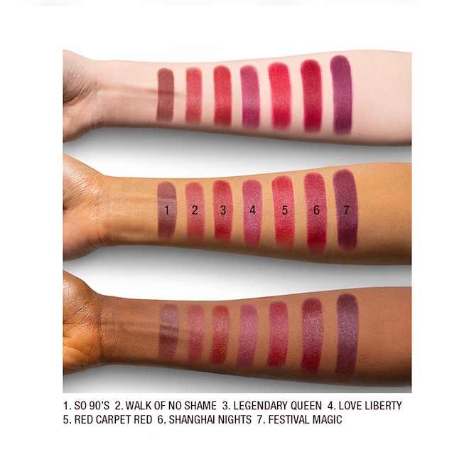 Matte Revolution red lipstick arm swatches Arm swatches on fair, medium, and dark tone models of matte lipsticks in shades of red, plum, and burgundy.