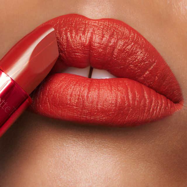 Model wearing Hollywood Honey and Fame Flame lip liner and lipstick combination