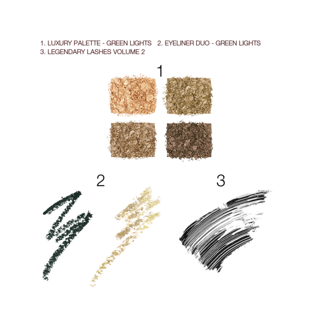 Green lights Magic Trick Kit swatches Swatches of four, shimmery eyeshadows in green and golden hues above two swatches of light green and dark green eyeliners, and a swatch of a jet-black mascara.