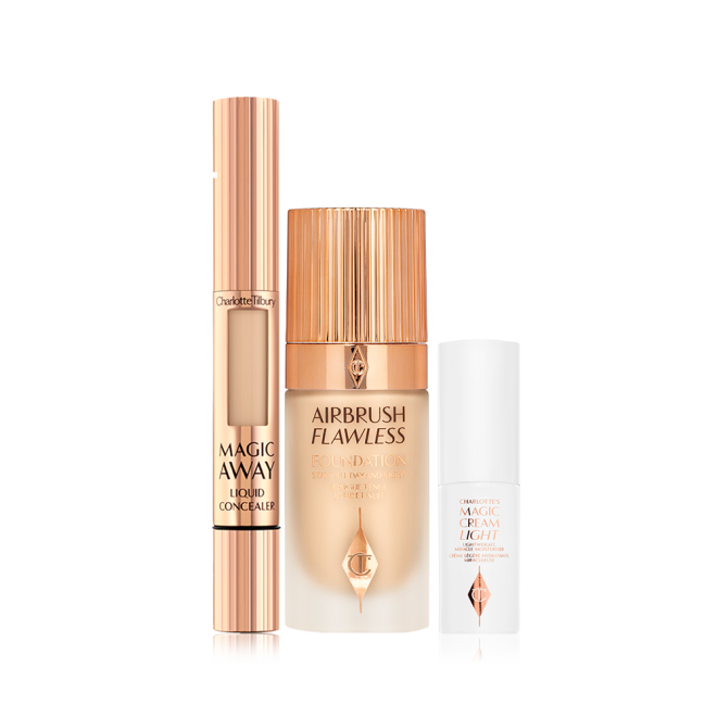 Creamy liquid concealer in a gold-coloured tube with a soft sponge applicator end, foundation in a frosted glass bottle with a gold-coloured lid, and pearly-white face cream in a glass jar with a gold coloured lid.