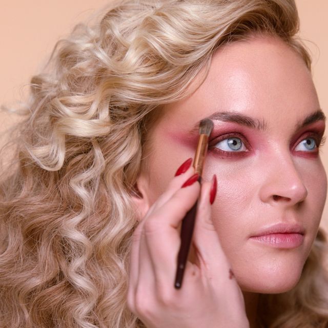 Step 6 in Sofia Tilbury's 80s Makeup Look tutorial: apply eyeshadow to highlight inner corners of the eyes