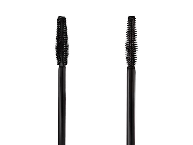 Close-up of the flat side and the front side of two, black-coloured mascara wands.