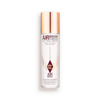 Charlotte Tilbury Airbrush Flawless Setting Spray bottle with a 'Best Seller' badge.

