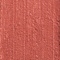 Swatch of a lip and cheek colour stick in a glowy nude rose shade. 