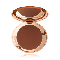 An open mirrored-lid bronzer compact in a dark brown shade. 