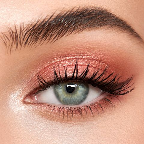 Eye close up of Pillow Talk Luxury Palette on blue-eyed model
