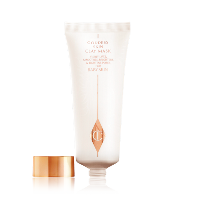 An open clay mask in white and rose gold tube with a rose-gold metallic lid. 