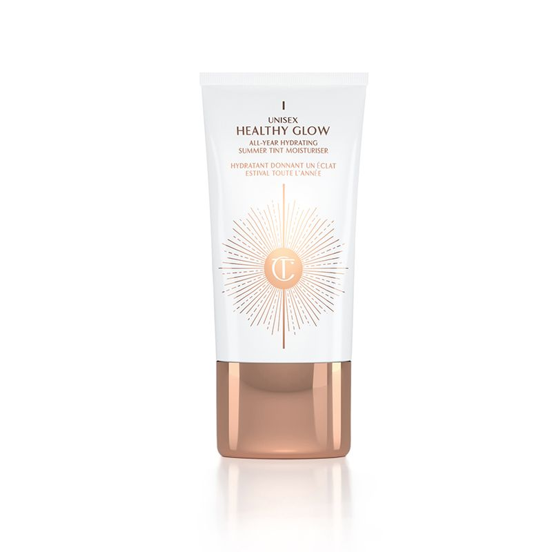 A tinted moisturizer in white and gold packaging with the iconic CT logo printed on the bottle and a rose-gold coloured lid. 