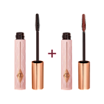 Two tubes of mascara, one with a lid on and one without, in a chocolate-brown-colour with a pink-coloured tube with a gold-coloured lid. 