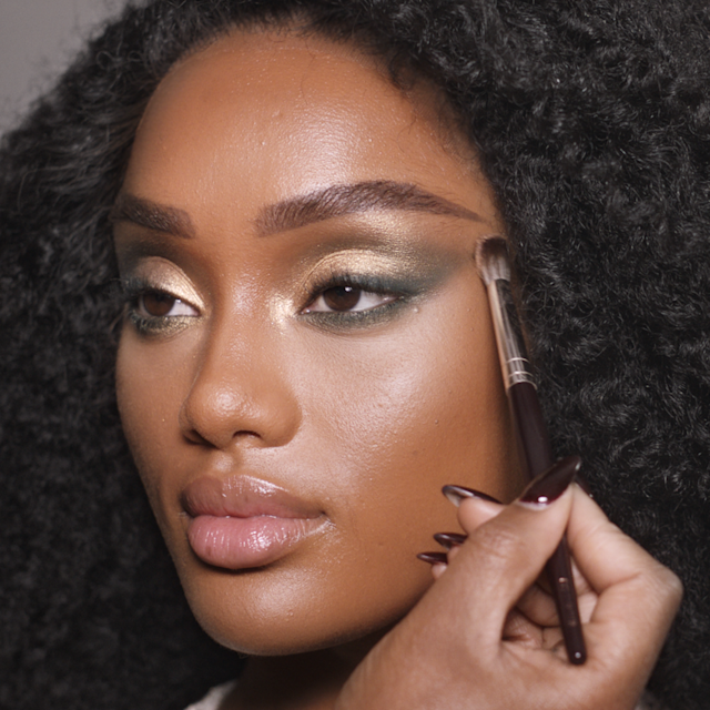 Step 5 in Charlotte's 70s makeup tutorial is building dimension with darker shades of eyeshadow