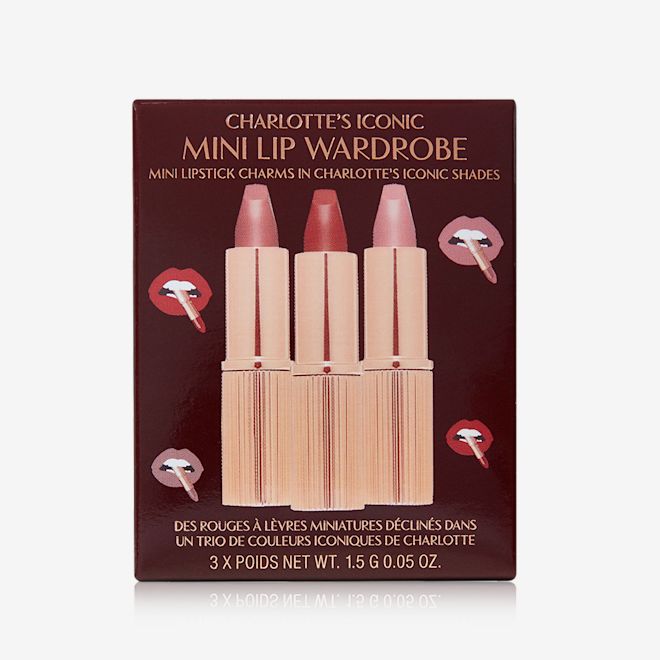 Charlotte's Iconic Mini Lip Wardrobe packed A dark brown coloured-box with three lipsticks inside in nude pink, pale pink, and berry-rose.